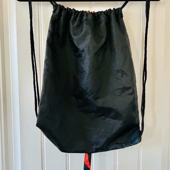 Spirit Halloween Drawstring Rainbow & Tiger Stripe Backpack with Dragon Tale - Picture 5 of 8